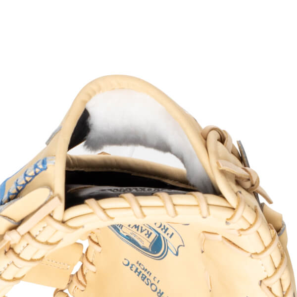 Close-up of the inside of a baseball glove showing the "RAWLINGS PROSBH3C 13 INCH" logo and blue lacing.