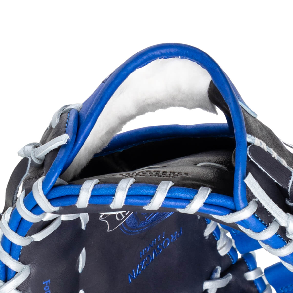Close-up of the top of a navy baseball glove with blue lacing and white trim. "PROSCVN" is visible.
