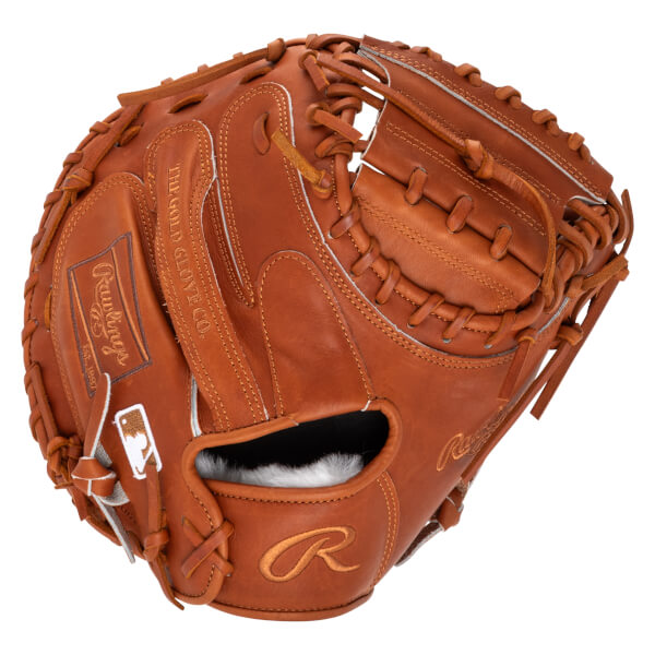 Top-down view of a brown leather baseball glove with Rawlings logo and MLB emblem.