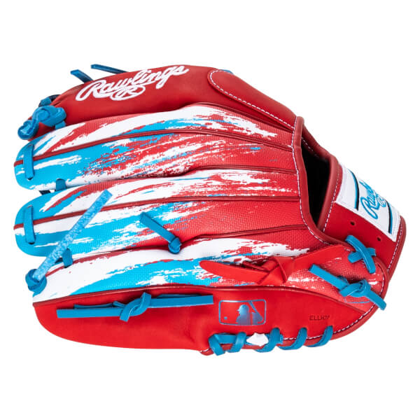 Front view of a red baseball glove with blue and white abstract paint strokes, blue lacing, and a Rawlings logo.