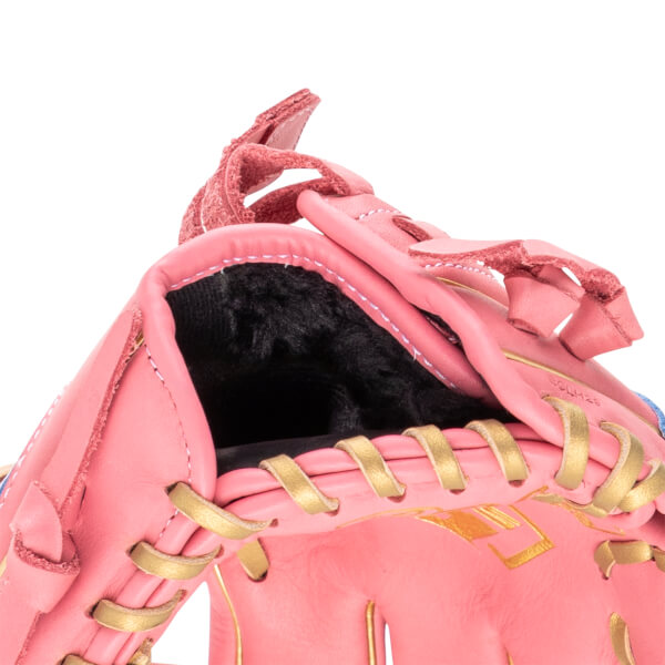 Close-up of a pink baseball glove showing gold lacing and the model number "ECLH28".