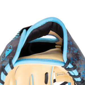Close-up of the inside of a baseball glove showing tan leather, blue piping, and a black and blue speckled pattern.