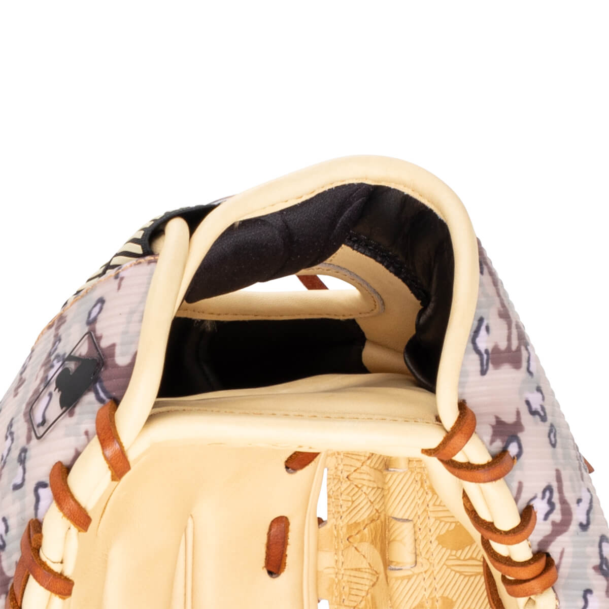 Close-up of a baseball glove showing the tan leather interior, camouflage pattern exterior, and MLB logo.