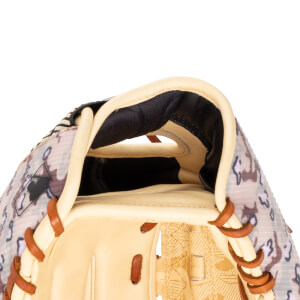 Close-up of a baseball glove showing the tan leather interior, camouflage pattern exterior, and MLB logo.