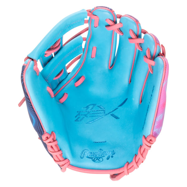 Top-down view of a blue baseball glove with pink lacing and a pink and blue patterned accent.