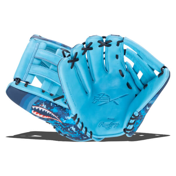Front view of a bright blue baseball glove with a shark graphic and "Rawlings" logo.