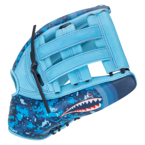 Side view of a light blue baseball glove with a shark graphic and digital camouflage pattern.