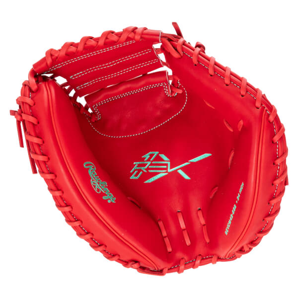 Top-down view of a red baseball glove with teal Rawlings logo and "REVCH48-34 INCH" text.