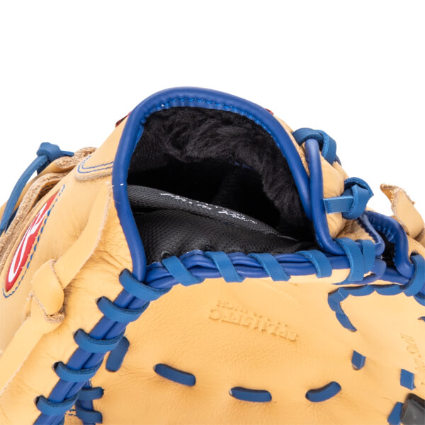 Close-up of a tan baseball glove's interior with black lining and blue lacing.