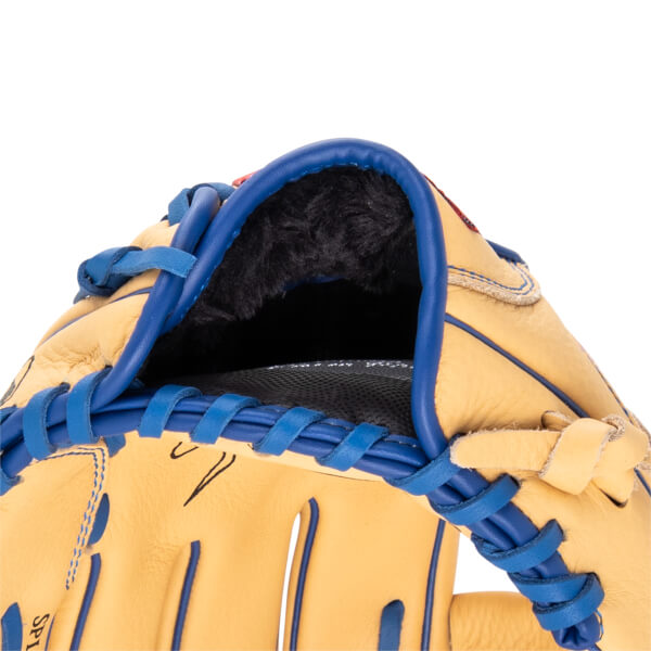 Close-up of the inside of a tan baseball glove with blue lacing and black fur lining.