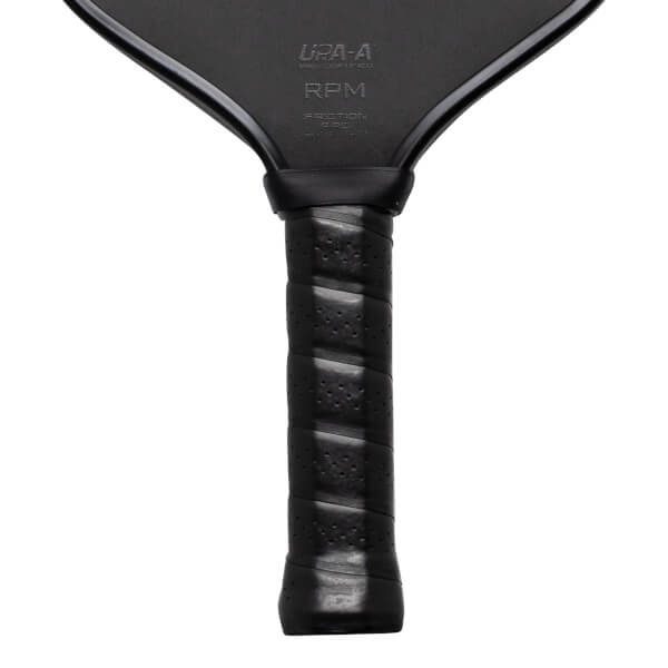 Close-up of a black pickleball paddle handle with "RPM" and "UPA-A" visible.