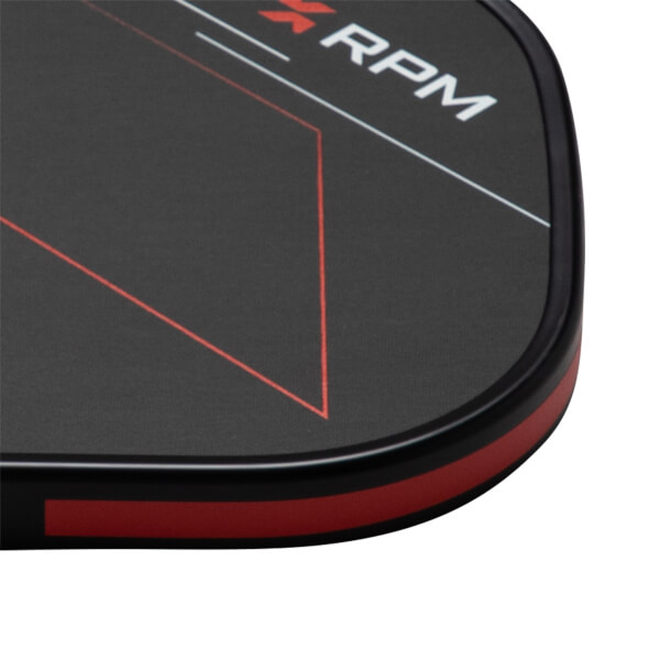 Close-up of a black surface with red and white lines, showing the word "RPM".
