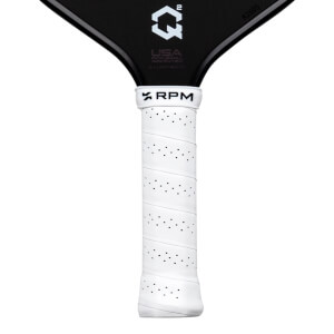 Close-up of a white perforated grip with "RPM" logo and a black pickleball paddle with "QÂ²" logo and "R2605".