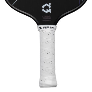Close-up of the white perforated grip and black paddle face displays the "RPM", "Q2", and "USA Pickleball Approved" branding.
