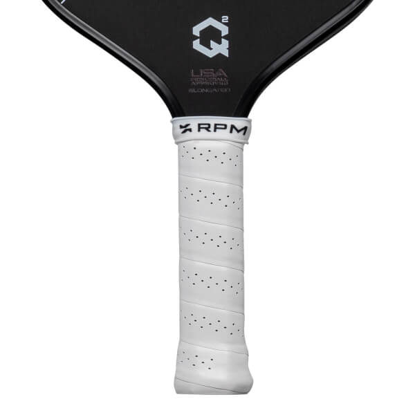 Close-up of the black paddle face featuring the Q2 logo and USA PICKLEBALL APPROVED text above a white perforated grip with RPM on the collar.