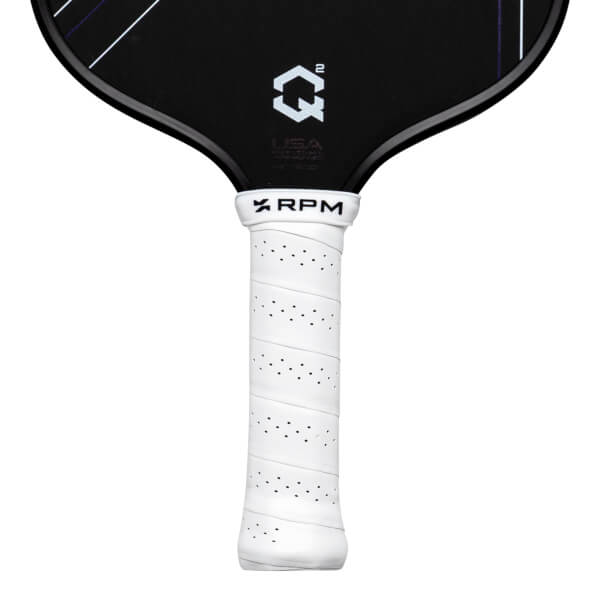 Close-up of a black pickleball paddle with a white grip, showing the "QÂ²" logo and "RPM" text.
