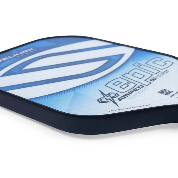 Side view of a blue and white Selkirk Amped Epic pickleball paddle with a large blue graphic and EPIC text.