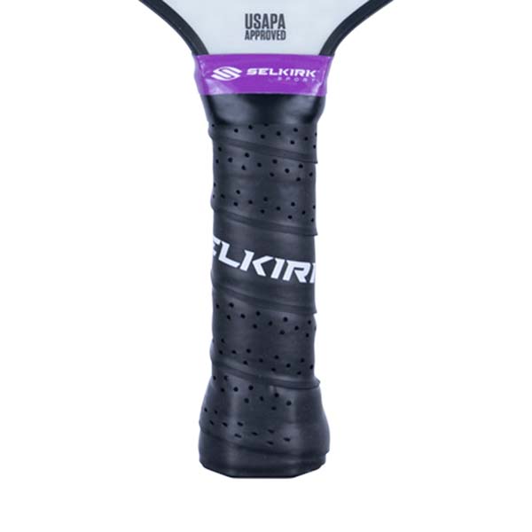 Close-up of a black pickleball paddle grip with SELKIRK text and USAPA Approved logo.