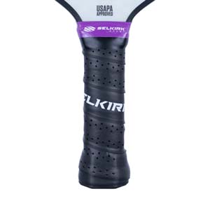 Close-up of a black pickleball paddle grip with SELKIRK text and USAPA Approved logo.