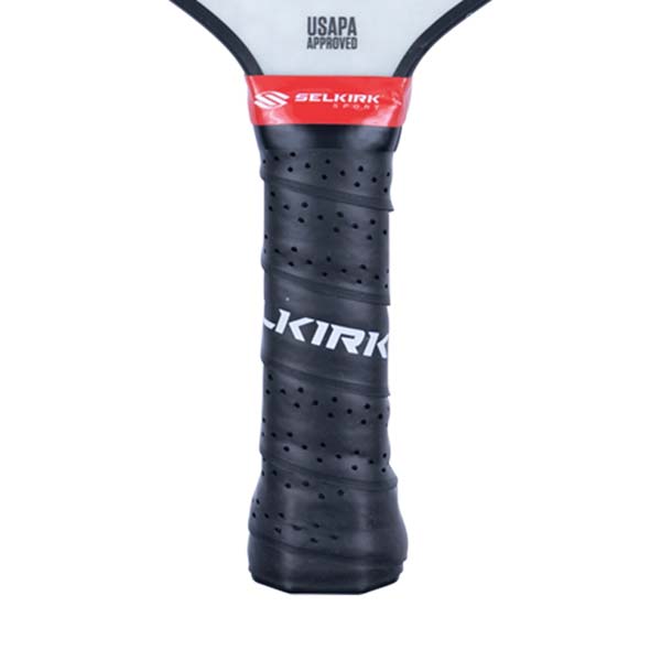 Close-up of a black pickleball paddle grip with KIRK text and USAPA APPROVED stamp.