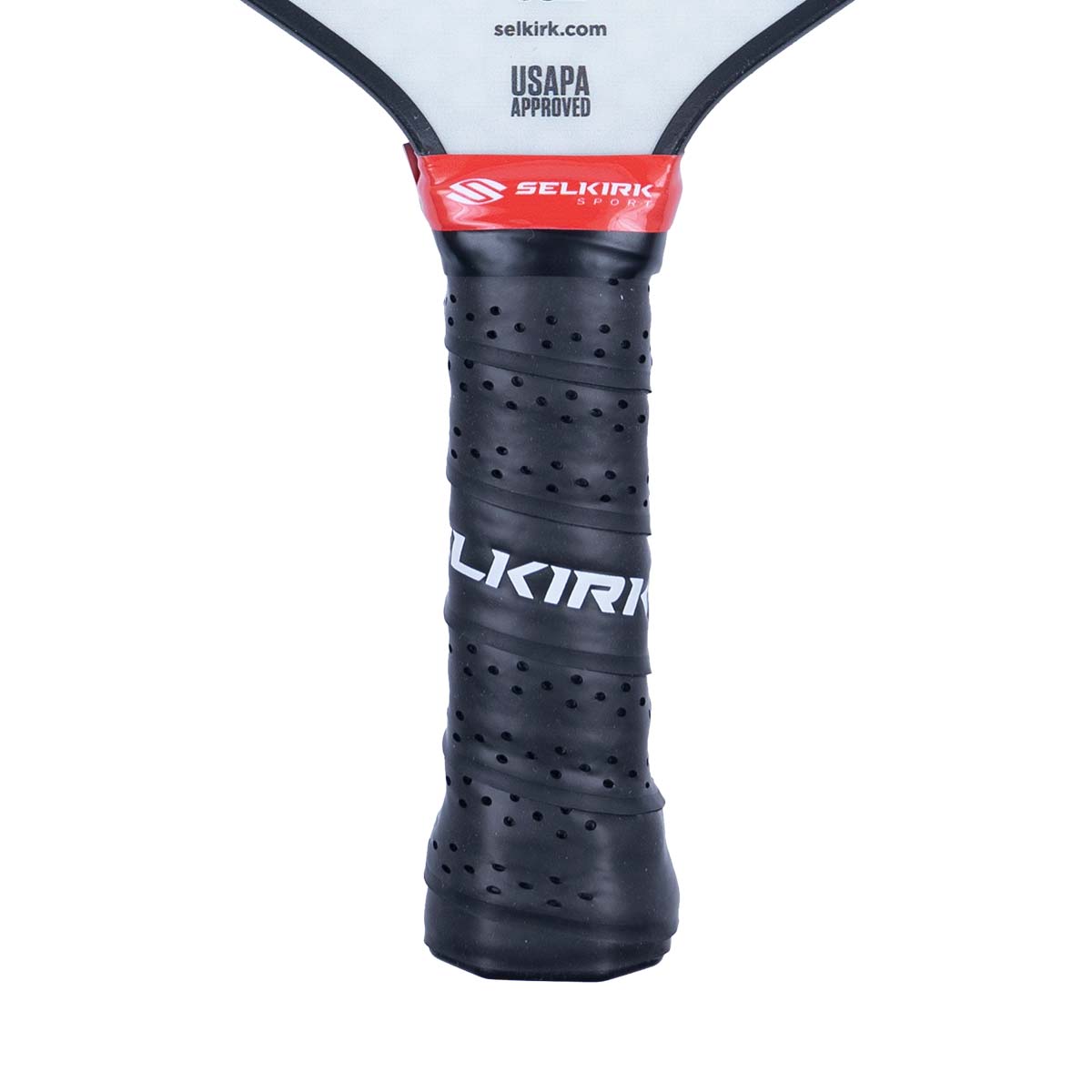 Close-up of a black pickleball paddle grip with perforations and white SELKIRK text.