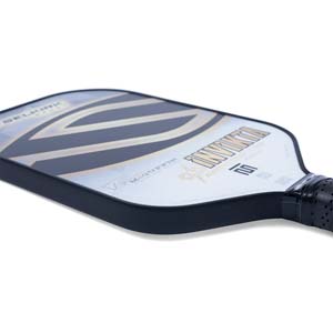 Side view of a white pickleball paddle with black and gold stripes, INVIKTA text, and MCGUFFIN branding.