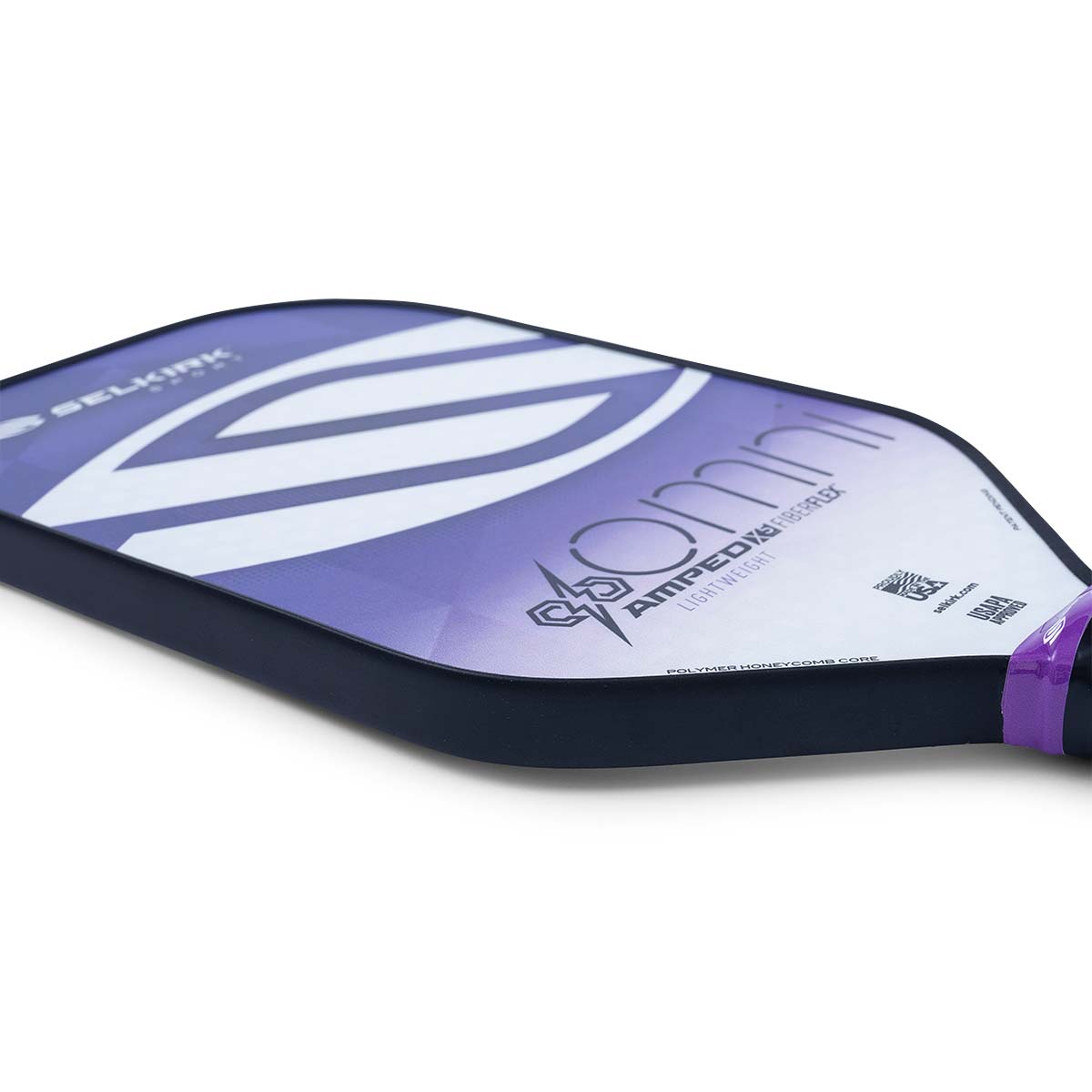 Side view of a purple and white Selkirk Amped Omni pickleball paddle with LIGHTWEIGHT text.