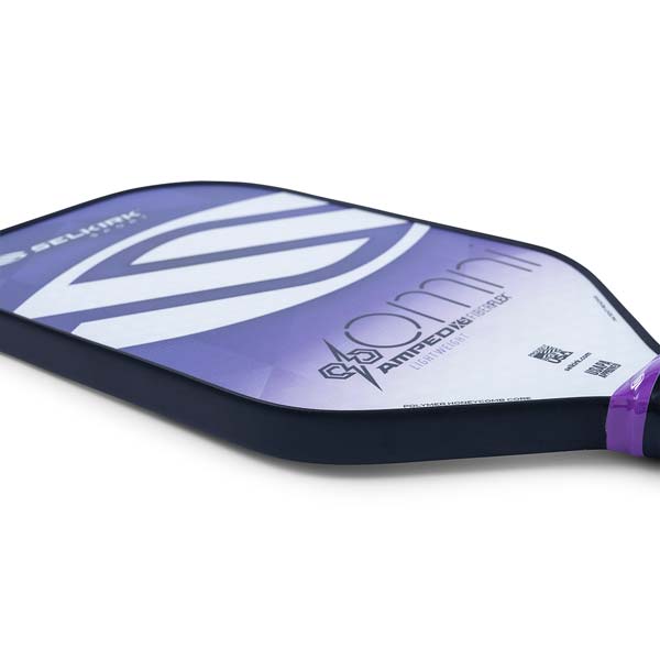 Side view of a purple and white Selkirk Amped Omni pickleball paddle with LIGHTWEIGHT text.