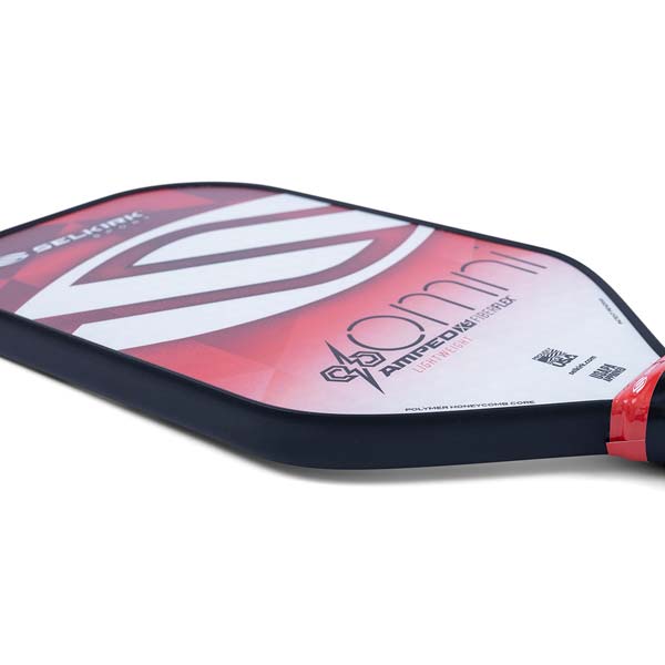 Side view of a red and white Selkirk Omni pickleball paddle with AMPLIFIED FIBERFLEX and LIGHTWEIGHT text.