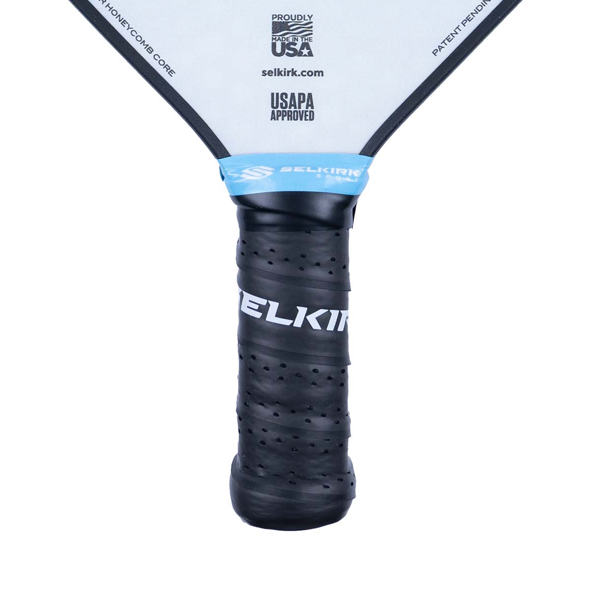Close-up of a black pickleball paddle grip with SELKIRK text and USAPA APPROVED logo.