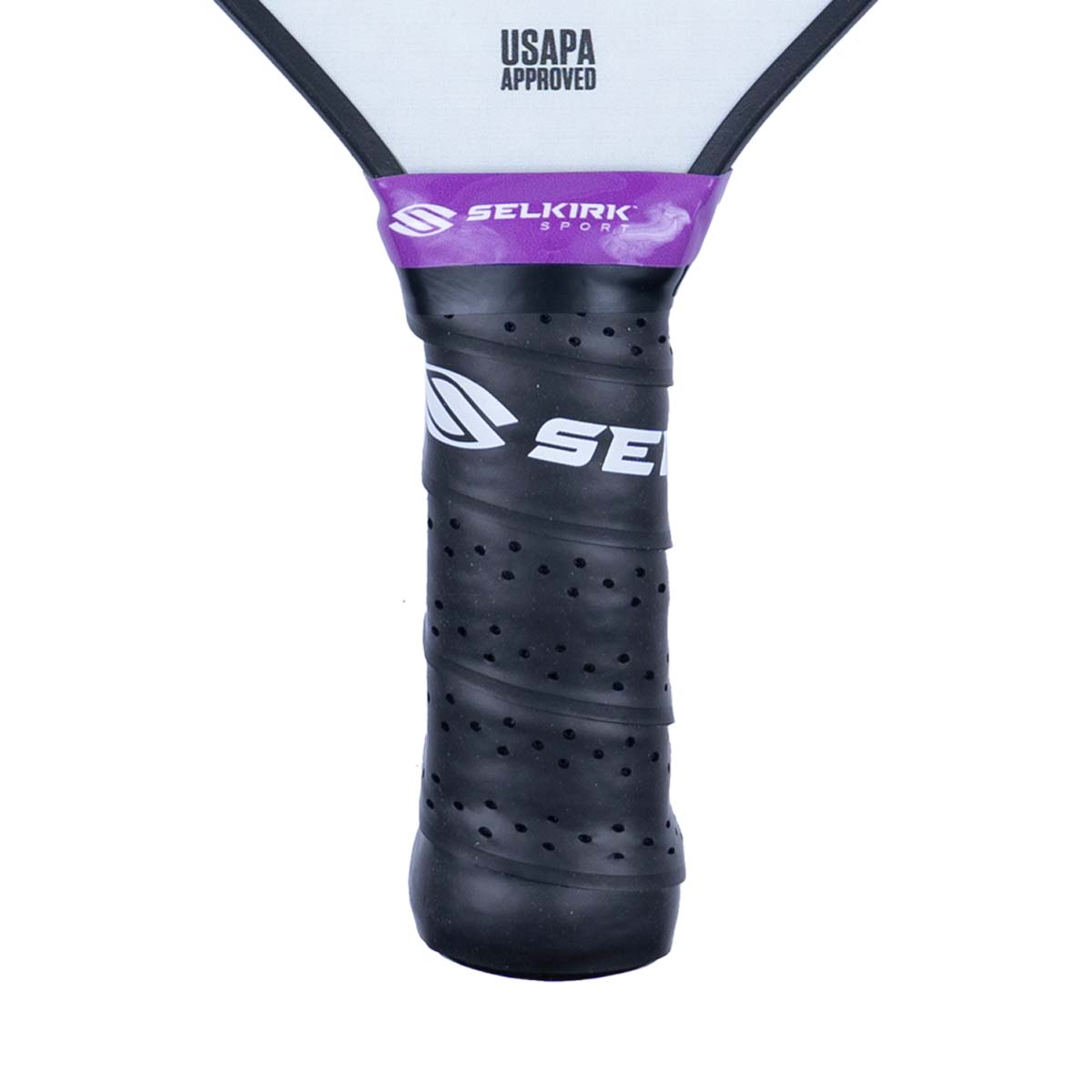 Close-up of a black pickleball paddle grip with purple Selkirk Sport branding and USAPA Approved text.