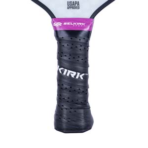 Close-up of a black pickleball paddle grip with KIRK branding and USAPA APPROVED text.
