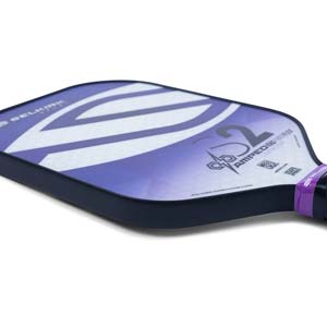Side view of a purple and white Selkirk Amped S2 pickleball paddle with a polymer honeycomb core.