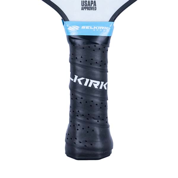Close-up of a black pickleball paddle grip with KIRK text and perforated texture.