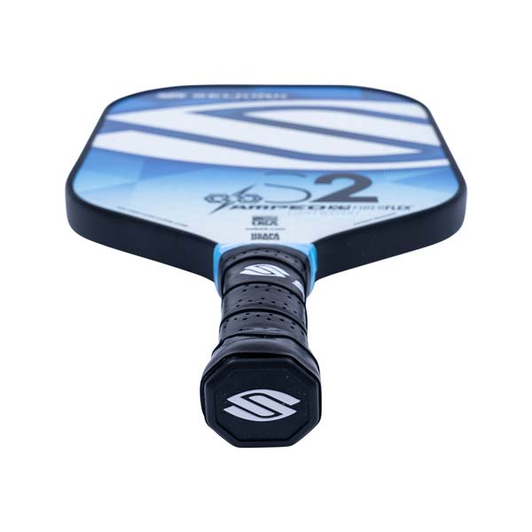 Top-down view of a white and blue pickleball paddle with a black grip and S2 logo.