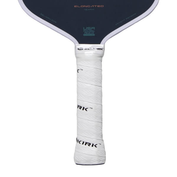 Close-up of a dark gray pickleball paddle with a white textured grip, SELKIRK logo, and ELONGATED text.