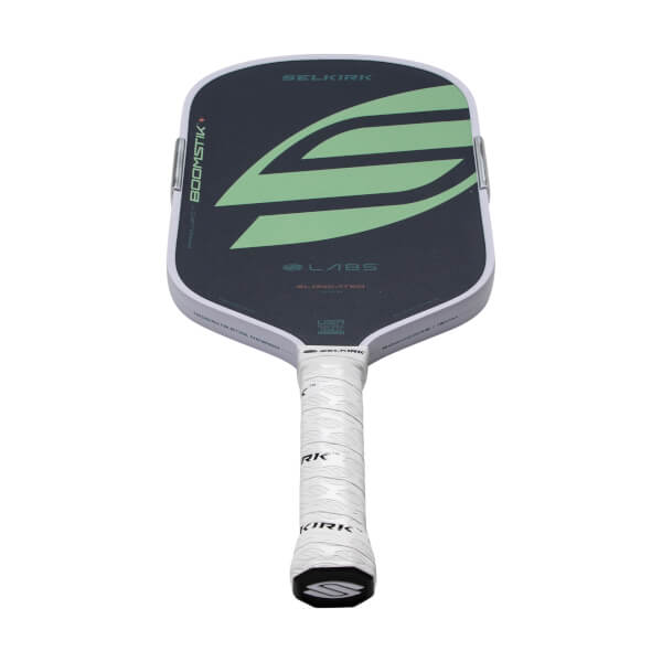 Front view of a dark gray Selkirk Boomstik pickleball paddle with a light green S graphic, white edge, and white wrapped grip.