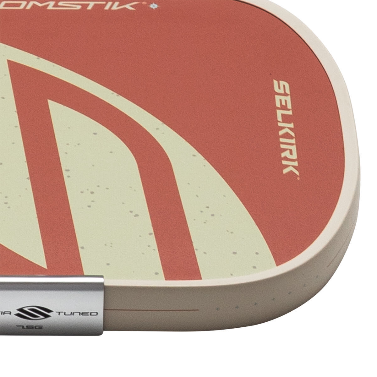 Corner view of a pickleball paddle with red and cream stripes, showing "SELKIRK" and "TUNED 7.5G".