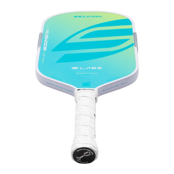 Top-down view of a Selkirk pickleball paddle with a white grip, blue and green gradient face, and "PROJECT BOOMSTIK" text.