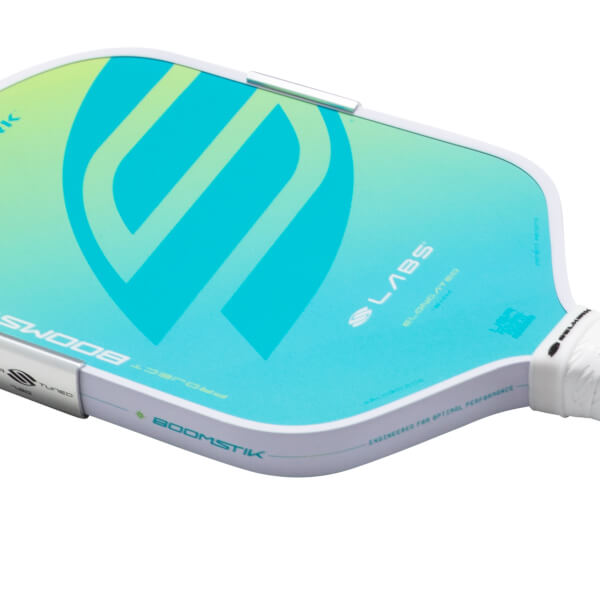 Corner view of a pickleball paddle with a blue and green gradient, featuring a large white "S" logo and "BOOMS" text.