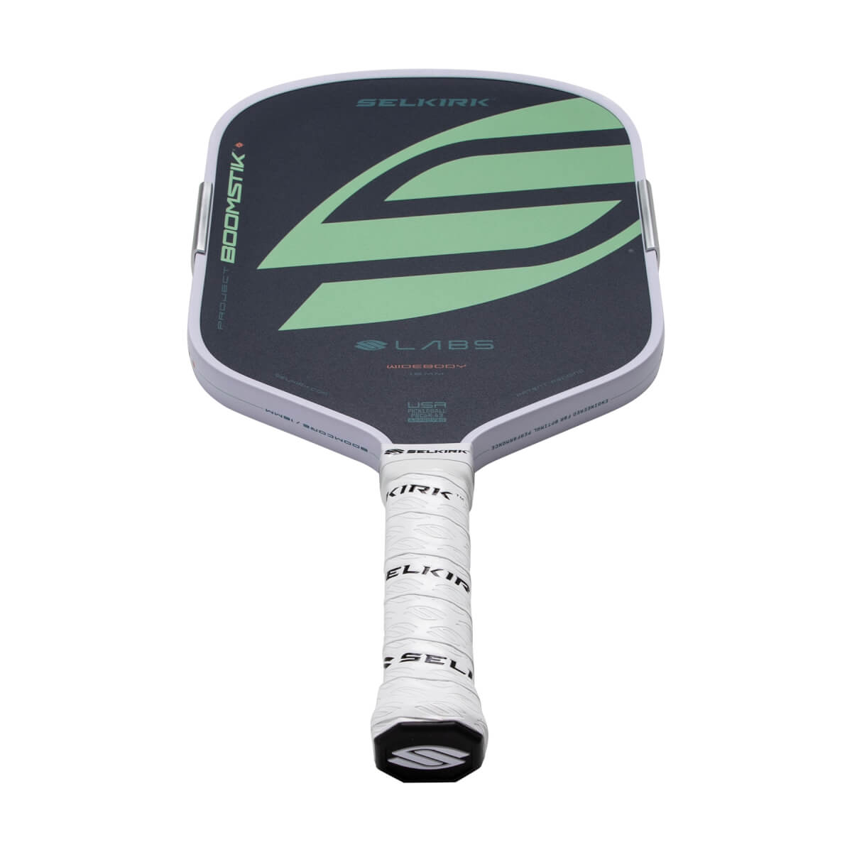 Angled front view of a dark gray Selkirk pickleball paddle with light green S graphic, BOOMSTIK text, and white grip.