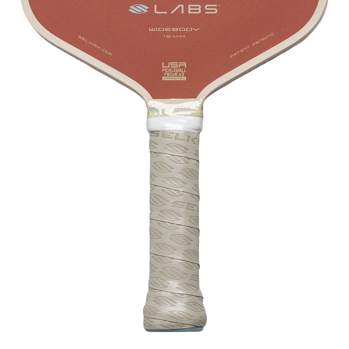 Close-up of pickleball paddle handle showing "SELKIRK" logo grip and "USA PICKLEBALL" text.