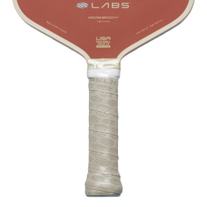 Close-up of pickleball paddle handle showing "SELKIRK" logo grip and "USA PICKLEBALL" text.