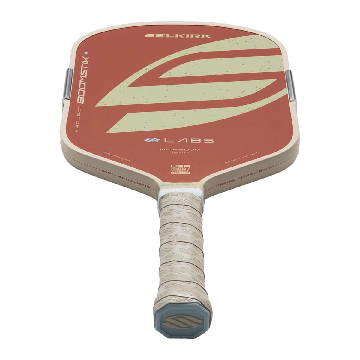 Top-down view of a pickleball paddle with a red face, cream trim, and "SELKIRK" logo.