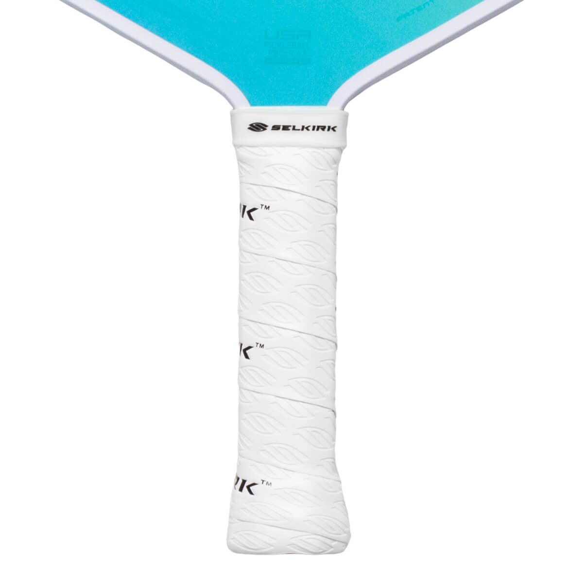 Close-up of a white pickleball paddle grip with a leaf pattern and the Selkirk logo.