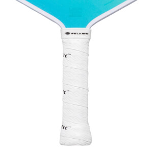 Close-up of a white pickleball paddle grip with a leaf pattern and the Selkirk logo.