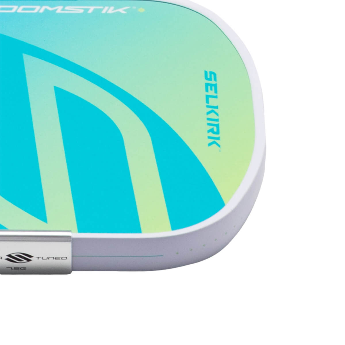 Corner view of a pickleball paddle with "SELKIRK" and "TUNED" text, featuring a blue and green gradient design.