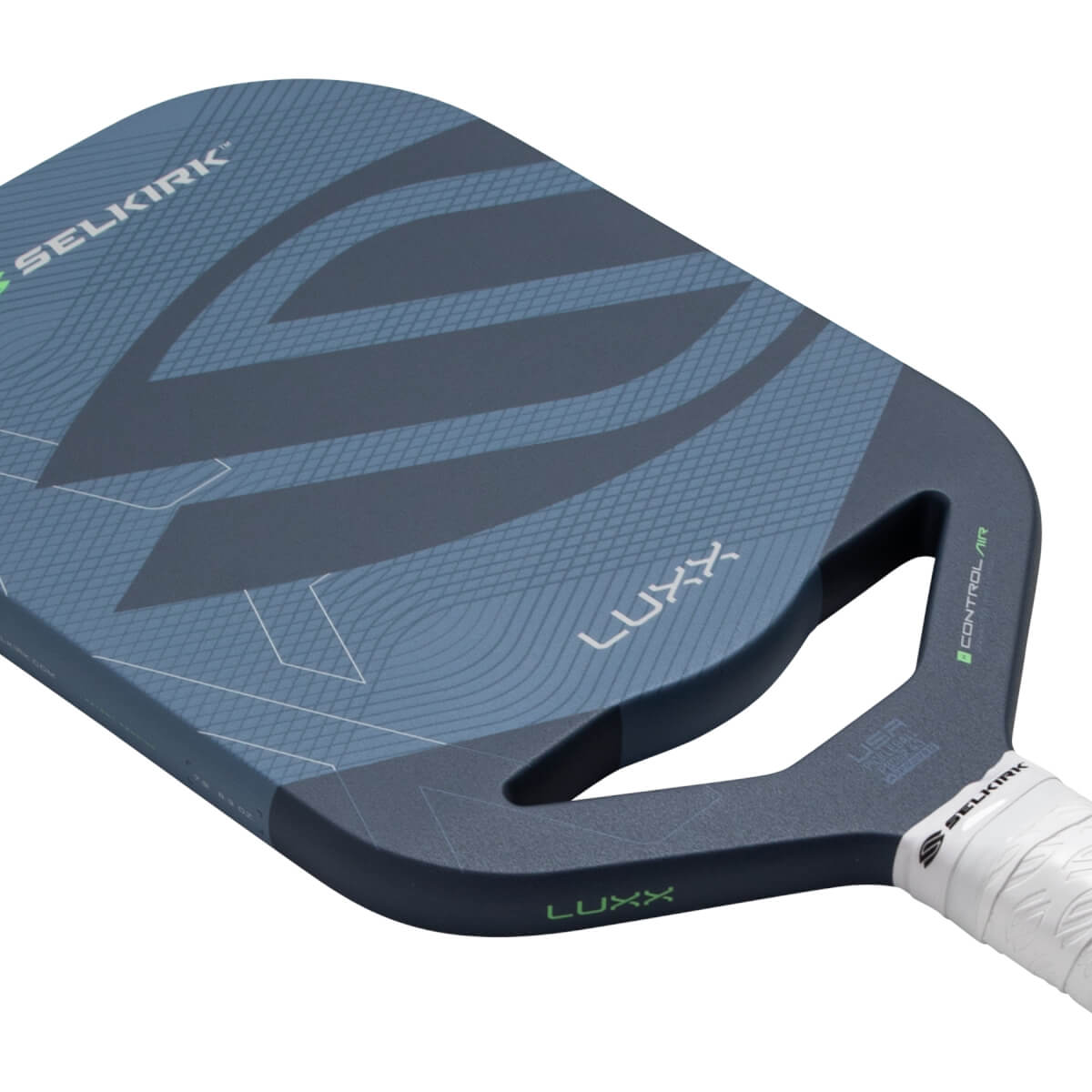 Angled close-up of a dark blue pickleball paddle with Selkirk and Luxx branding, geometric patterns, and an open throat.