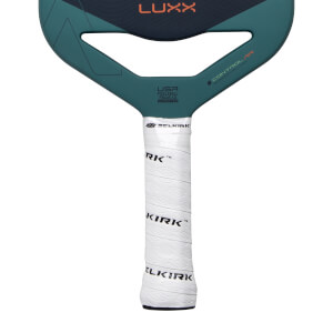 Close-up of a dark blue and teal pickleball paddle with a white SELKIRK grip and LUXX text.