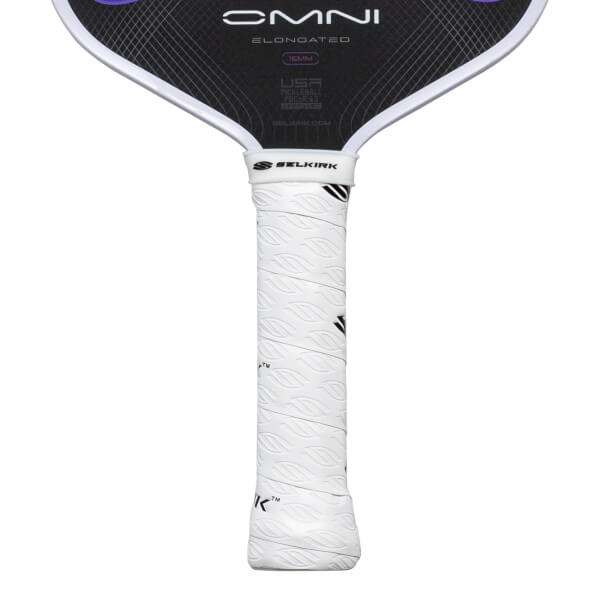 Close-up of a pickleball paddle grip showing the white textured grip and the "SELKIRK" logo.